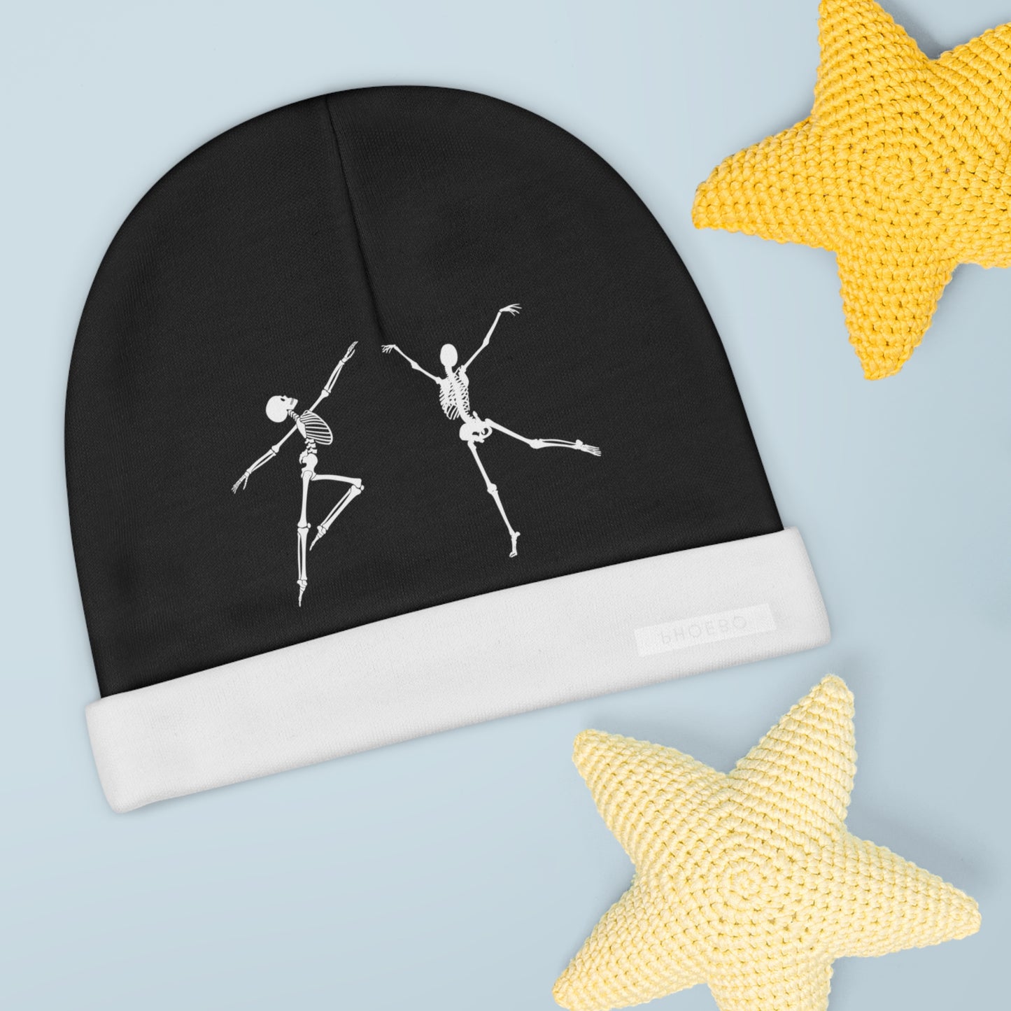 
                  
                    Black baby beanie with white skeleton dancers graphic and folded cuff with brand patch
                  
                