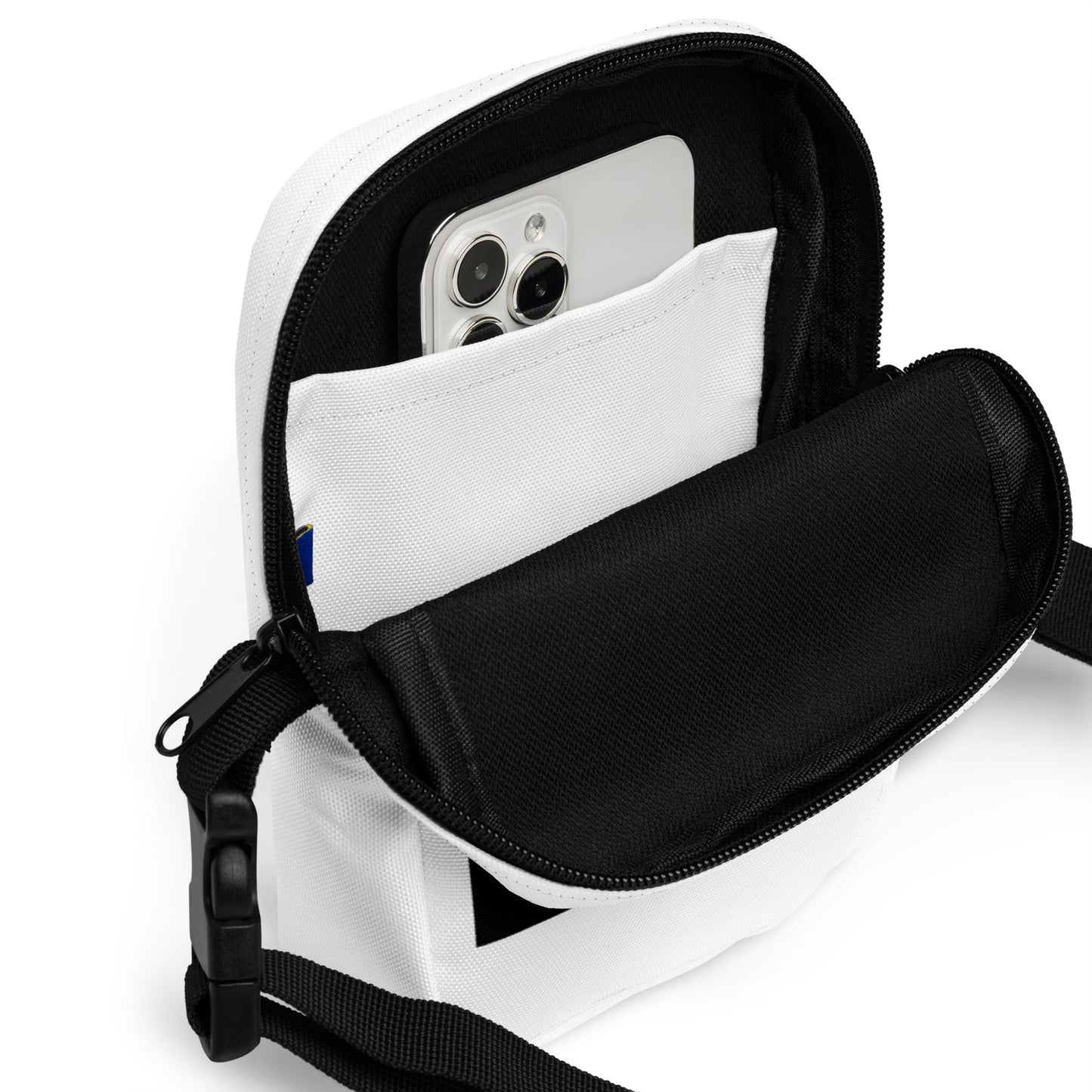 
                  
                    White crossbody bag open top with black interior phone pocket and zip closure
                  
                