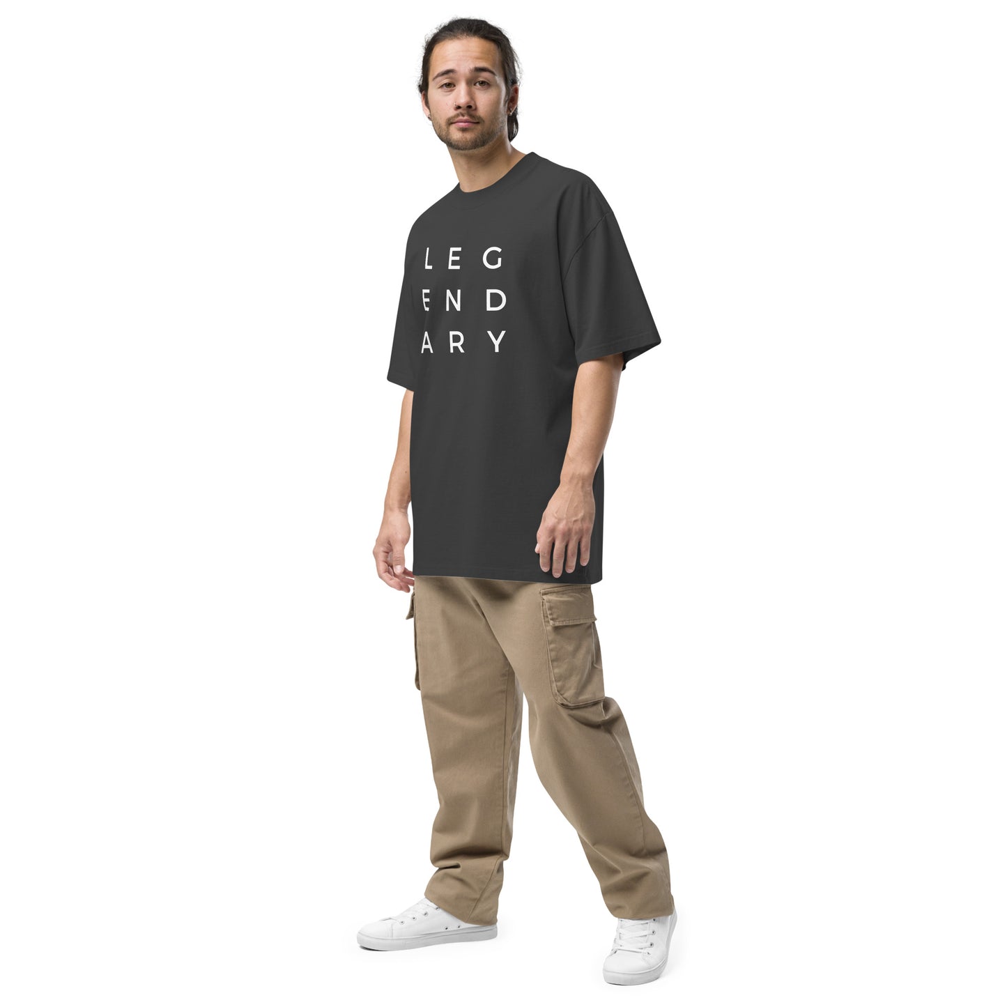 
                  
                    Black oversized T-shirt with "LEGENDARY" logo print on the front, worn on model.
                  
                